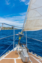 Obraz premium Sailboat's bow sailing toward Maddalena Archipelago, Sardinia Italy