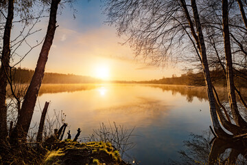 Sunrise at the lake, nature landscape with forest and water - obrazy, fototapety, plakaty