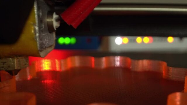 3d printing printer red model close-up. Automatic 3D printer