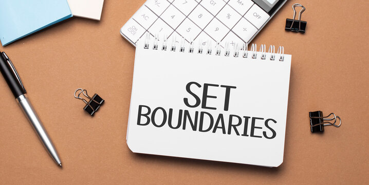 set boundaries on notepad with pen, glasses and calculator