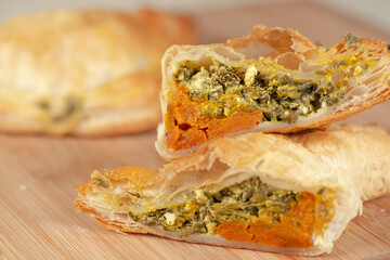 Freshly baked spinach triangle pastry with danish feta and roasted pumpkin.