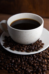 Coffe cup with milk and coffee grains
