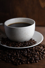 Coffe cup with milk and coffee grains