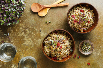 Two bowls of healthy quinoa pumpkin seeds.