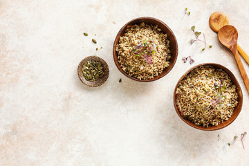 Fototapeta na wymiar Healthy vegan grain bowls with quinoa and pumpkin seeds.