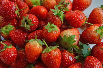 Beautiful red skin of fresh strawberry fruit close up
