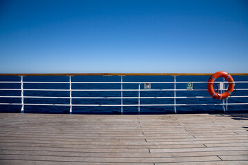 Railings on cruise ship deck with ocean view
