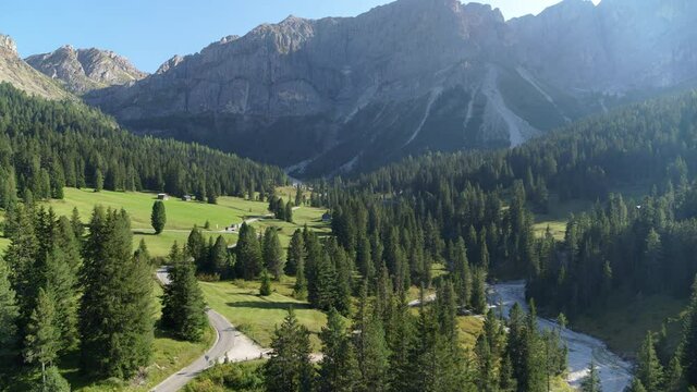 Road to the passo delle erbe in the alps, beautiful aerial landscape of tight road surrounded by fields and forests. Epic landscape and roads. Paradise, adventure seekers