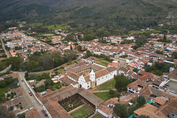Fototapeta na wymiar Aerial view of a monastery surrounded by Spanish colonial style houses in the town of Villa de Leyva. Colombia.