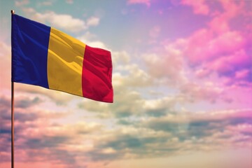 Fluttering Romania flag mockup with the space for your content on colorful cloudy sky background.