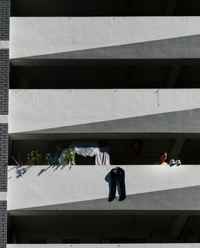 Sunning Clothes And Shoes Along Corridor Of HDB Flat