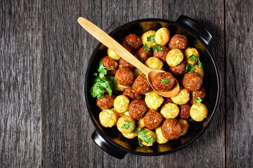 Meatballs and spaghetti balls top view, close-up