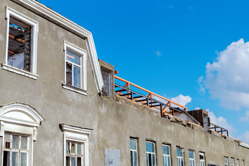 Repair of the roof on the old house. A building without a roof. Structures for installation.