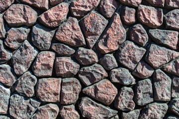 Texture. Large stones with a dirty pink hue.