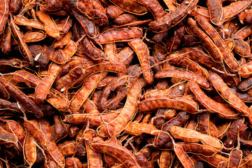 Close up fresh tamarind peel background, healthy fruit