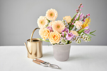 Finished flower arrangement in a vase for home. Flowers bunch, set for interior. Fresh cut flowers for decoration home. European floral shop. Delivery fresh cut flower.