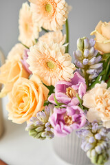 Finished flower arrangement in a vase for home. Flowers bunch, set for interior. Fresh cut flowers for decoration home. European floral shop. Delivery fresh cut flower.