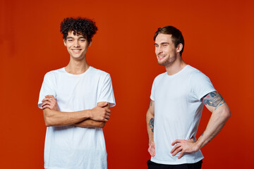Two cheerful friends t-shirts communicating isolated background friendship