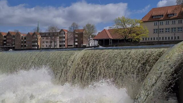 Waterfall on river Weser in city Hamelin in Germany