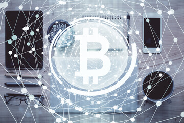 Double exposure of blockchain theme hologram over table with phone. Top view. Crypto technology...