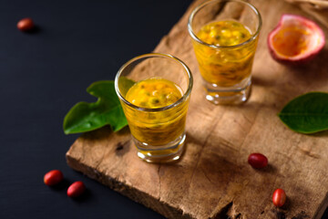 Fresh passion fruit juice in a glass on wooden, Healthy tropical drink