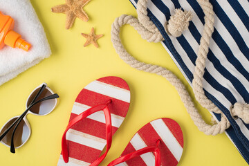 Top view photo of white towel orange sunscreen bottle starfishes beach bag striped flip-flops and...