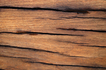 Naklejka premium The abstract background of the old wooden surface is wet after rain.