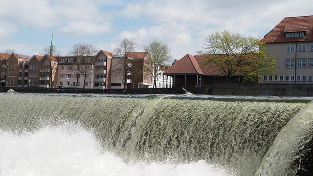 Waterfall on river Weser in city Hamelin in Germany