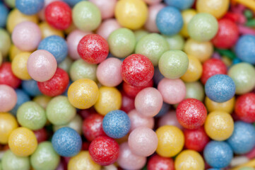 Fototapeta na wymiar Candy background .Close-up of miniature multi-colored candies used to decorate cakes.