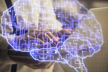 Multi exposure of woman hands working on computer and human brain hologram drawing. Ai tech concept.