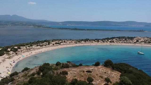 Aerial panorama view of the famous semicircular sandy beach and lagoon of Voidokilia in Messenia, Greece