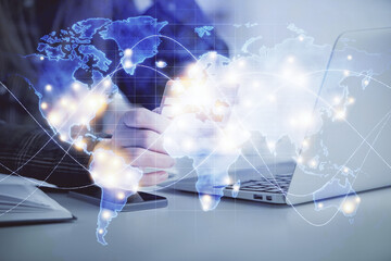 Multi exposure of woman on-line shopping holding a credit card and financial theme drawing. Business E-commerce concept.