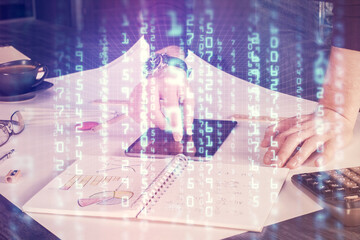 Double exposure of man's hand holding and using a digital device and data theme drawing. Technology concept.