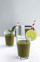 Homemade vegetable green smoothie with apple, cucumber, mint and lime