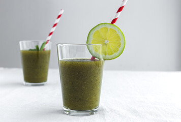 Homemade vegetable green smoothie with apple, cucumber, mint and lime