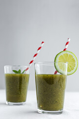 Homemade vegetable green smoothie with apple, cucumber, mint and lime