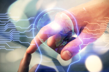 Double exposure of man's hand holding and using a digital device and brain hologram drawing. Data...