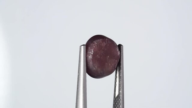 natural scapolite gemstone on the white turning table