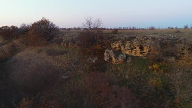 Evening flight over an autumn meadow
