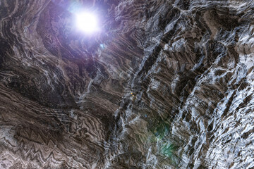 Abstract gray texture of natural, raw salt in an underground salt mine
