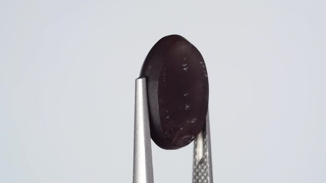 natural scapolite gemstone on the white turning table