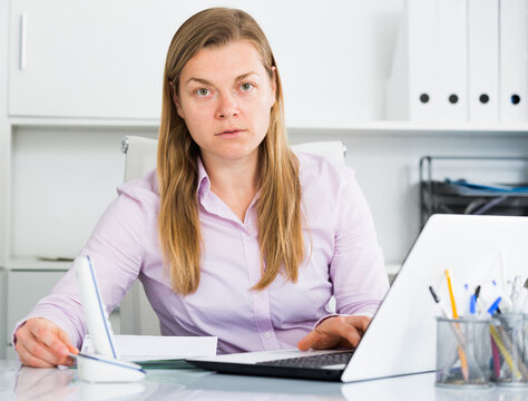 Young woman worker facing challenge in project in office