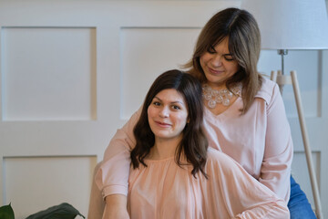 mother and adult daughter in the park, family portrait