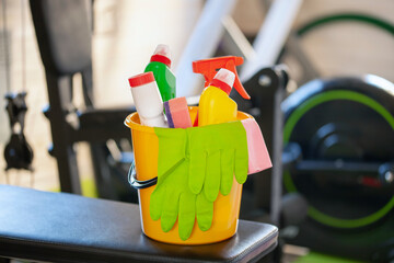 Spring cleaning in the home gym. Bucket with cleaning facilities