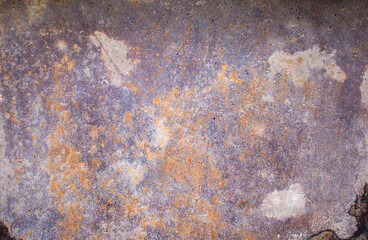 Abstract background of rusty damaged and dirty metallic plate with scratches, cracks and colorful stains. Plain and rich texture of grungy tinware.