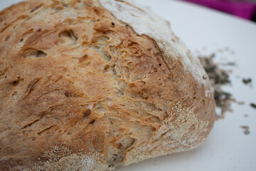 Seeded Bread, bread making, home made bread, sourdough, natural yeast bread, rustic bread, home baking, sun over a loaf of bread, close up