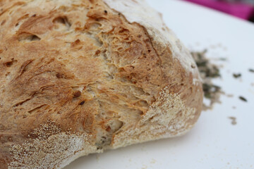 Seeded Bread, bread making, home made bread, sourdough, natural yeast bread, rustic bread, home baking, sun over a loaf of bread, close up
