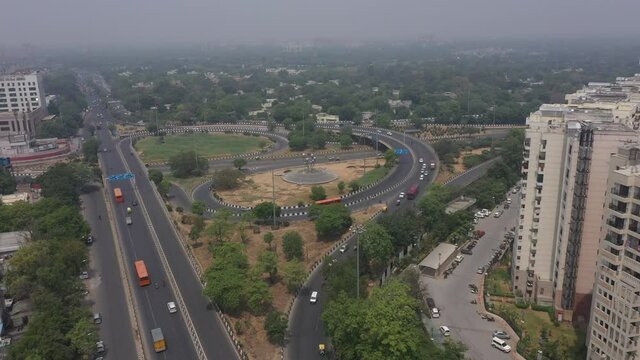 An aerial shot of the AIIMS flyover with running traffic during the COVID-19 pandemic in New Delhi, India
