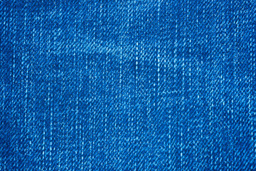close up of blue slub jean or slub denim fabric , the slub is difference size of thread woven together