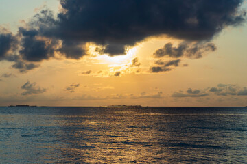 Naklejka na ściany i meble Dramatic sunrise over the sea. Nature